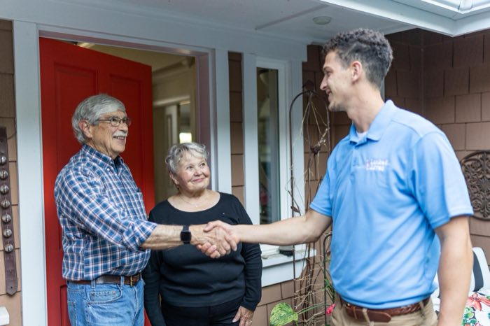 Linked Lives helper completing seasonal home tasks for a senior