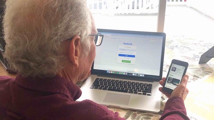 Linked Lives helper providing patient tech help during a senior visit